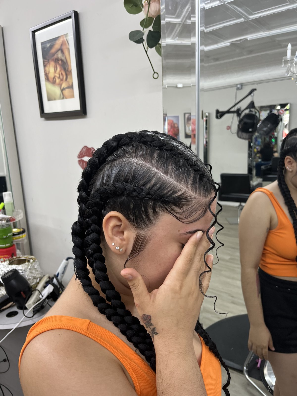 Sleek straight-back cornrows braided at a Westchester NY hair salon